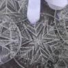 Lucky dip engraved snowflake decorative lens decoration. Made from reclaimed glasses lenses.